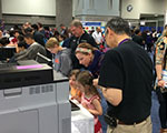 NIGMS staff volunteer demonstrating how the protein letter computer activity works